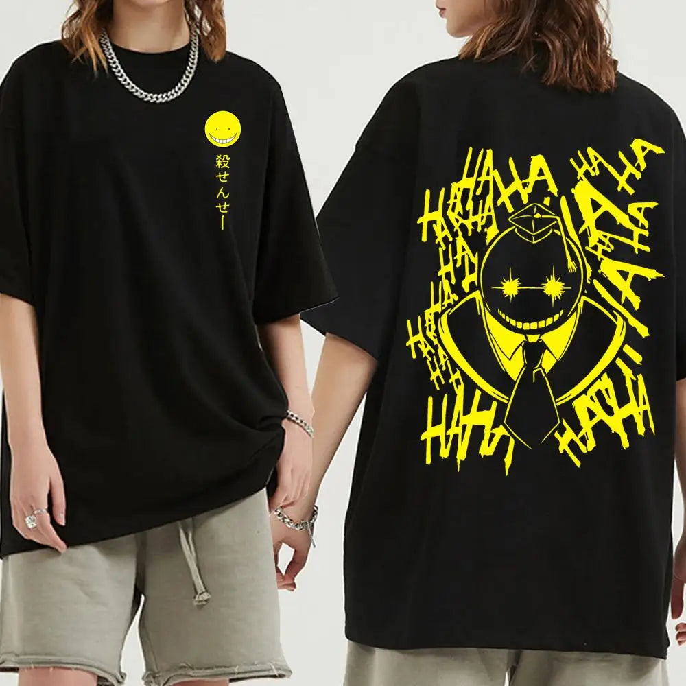 Black t-shirt with anime assassination classroom yellow graphic design on front and back worn by a person.