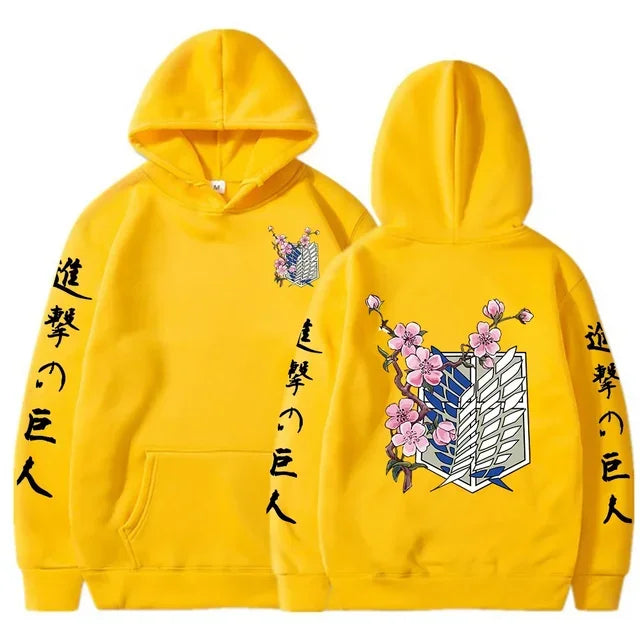Yellow anime streetwear hoodie with Attack on Titan Survey Corps emblem, cherry blossom design, and Japanese kanji text on sleeves.