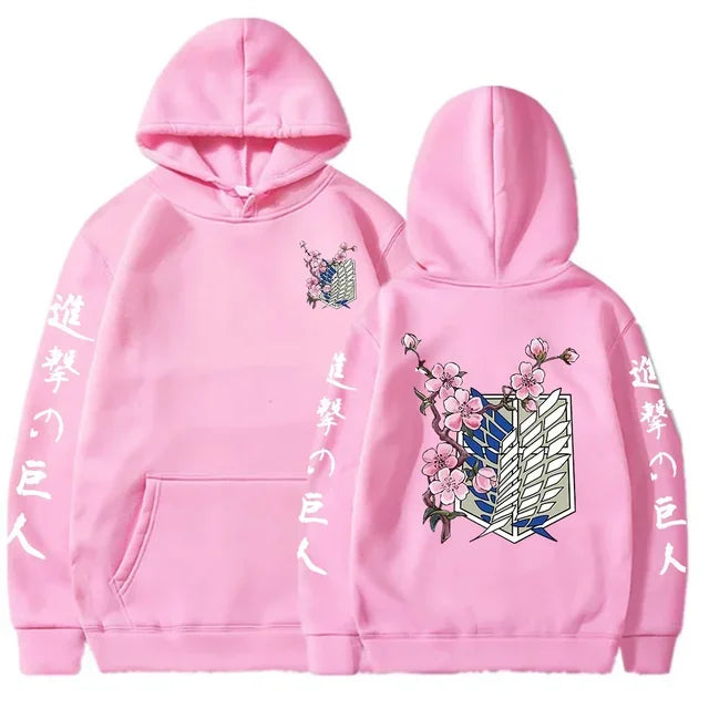 Pink anime streetwear hoodie with Attack on Titan Survey Corps emblem, cherry blossom design, and Japanese kanji text on sleeves.