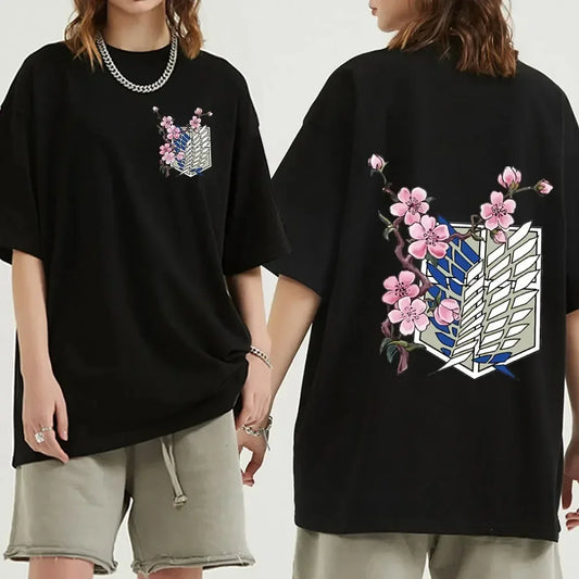 Black oversized Attack on Titan anime streetwear t-shirt featuring Survey Corps Wings of Freedom emblem with pink cherry blossom design on front and large back print, Japanese urban fashion style.